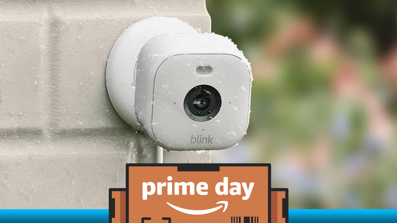 A Blink Mini 2 camera mounted on an outdoor wall. Prime Day overlaid text.