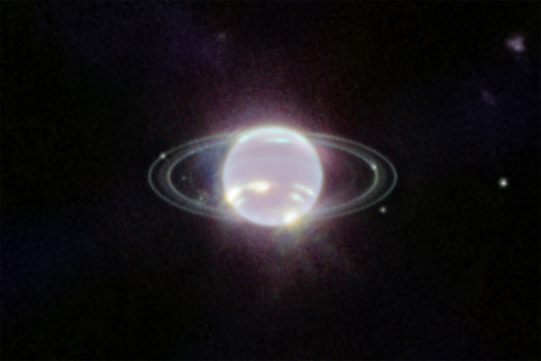 A closer view of Neptune and six of its moons (Galatea, Naiad, Thalassa, Despina, Proteus and Larissa).