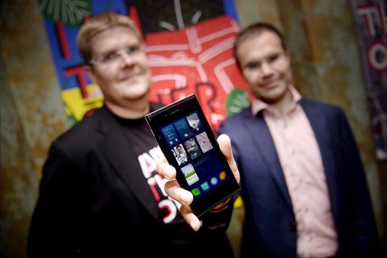 One of the founders of Jolla company, Sami Pienimaki and company's CEO Tomi Pienimaki (R) present the new Jolla smartphone in Helsinki, Finland on May 20, 2013. The phone uses Linux-based Sailfish operating system and it is compatible with Android applications. AFP LEHTIKUVA / Kimmo Mäntyla / FINLAND OUT        (Photo credit should read KIMMO MANTYLA/AFP via Getty Images)