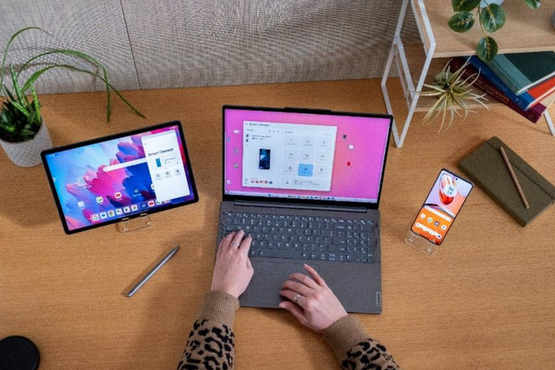 A Lenovo ThinkPad next to a tablet and smartphone. 