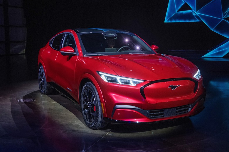 Ford reveals its first mass-market electric car the Mustang Mach-E, which is an all-electric vehicle that bears the name of the companys iconic muscle car at a ceremony in Hawthorne, California on November 17, 2019. - This is Ford's first serious attempt at making a long-range EV and will be the flagship of a new lineup that will include an electric F-150 pickup truck. (Photo by Mark RALSTON / AFP) (Photo by MARK RALSTON/AFP via Getty Images)