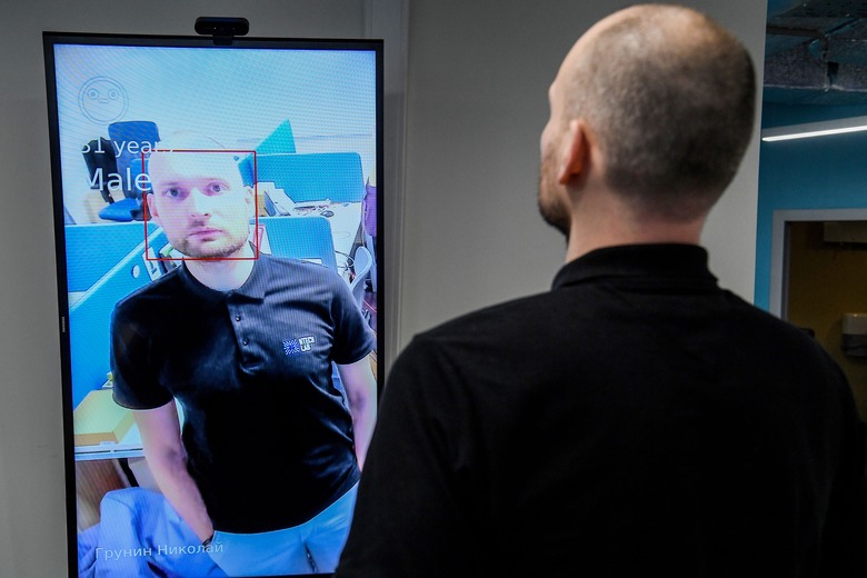 Nikolai Grunin, an employee at NtechLab, the company that won the city's tender to supply the facial recognition technology, demonstrates the technology during an interview with AFP on February 5, 2020. - A vast and contentious network of facial-recognition cameras keeping watch over Moscow is now playing a key role in slowing the rapid spread of coronavirus in Russia. (Photo by Kirill KUDRYAVTSEV / AFP) (Photo by KIRILL KUDRYAVTSEV/AFP via Getty Images)