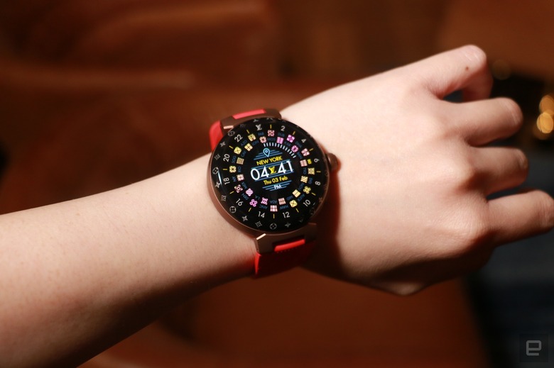 The Louis Vuitton Tambour Horizon Light Up smartwatch with a red rubber strap on a wrist. 