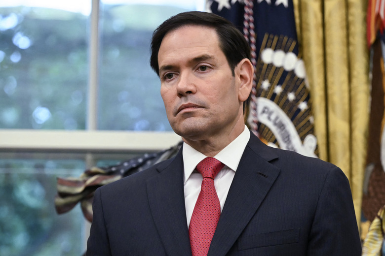 US Secretary of State Marco Rubio listens as US President Donald Trump (not pictured) speaks during with Democratic Republic of the Congo Foreign Minister Thérèse Kayikwamba Wagner and Rwandan Foreign Minister Olivier Nduhungirehe (not pictured) in the Oval Office of the White House in Washington, DC, on June 27, 2025. Rwanda and the Democratic Republic of Congo signed an agreement in Washington on Friday to put an end to a conflict in the eastern DRC that has killed thousands, although broad questions loom on what it will mean. Trump has trumpeted the diplomacy that led to the deal and publicly complained that he has not received a Nobel Peace Prize. But the agreement has also come under scrutiny for its vagueness including on the economic component, with the Trump administration eager to compete with China and profit from abundant mineral wealth in the long-turbulent east of the vast DRC. (Photo by ANDREW CABALLERO-REYNOLDS / AFP) (Photo by ANDREW CABALLERO-REYNOLDS/AFP via Getty Images)          