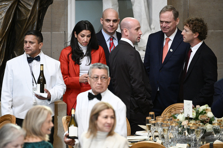 Mark Zuckerberg listens attentively to Stephen Miller at Trump's January inauguration
