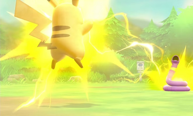Pikachu is shown hovering off the ground and surrounded by electricity as a bolt hits the snake Pokemon Ekans in a still from Let' Go Pikachu