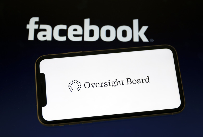 ANKARA, TURKEY - MAY 07: Facebook logo is seen on a smartphone as Oversight Board at the background in Ankara, Turkey on May 07, 2020. (Photo by Hakan Nural/Anadolu Agency via Getty Images)