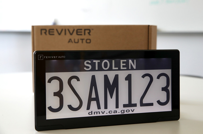 FOSTER CITY, CA - MAY 30:  A digital license plate made by Bay Area company Reviver Auto, part of a pilot project with the state Department of Motor Vehicles, is displayed at Reviver Auto headquarters on May 30, 2018 in Foster City, California. California is the first state in the U.S. to test digital license plates on vehicles. According to the California State Department of Motor Vehicles, there are currently 116 cars in California that are part of a pilot program testing the new plates that will eventually be sold at auto dealerships for $699 plus installation costs. Digital plates are expected to roll out in Florida, Arizona, and Texas later this year.  (Photo by Justin Sullivan/Getty Images)