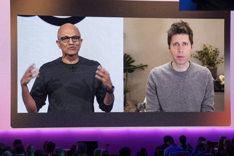 Microsoft Chairman and Chief Executive Officer Satya Nadella (L), speaks with OpenAI Chief Executive Officer Sam Altman, who joined by video during the Microsoft Build 2025, conference in Seattle, Washington on May 19, 2025. (Photo by Jason Redmond / AFP) (Photo by JASON REDMOND/AFP via Getty Images)          