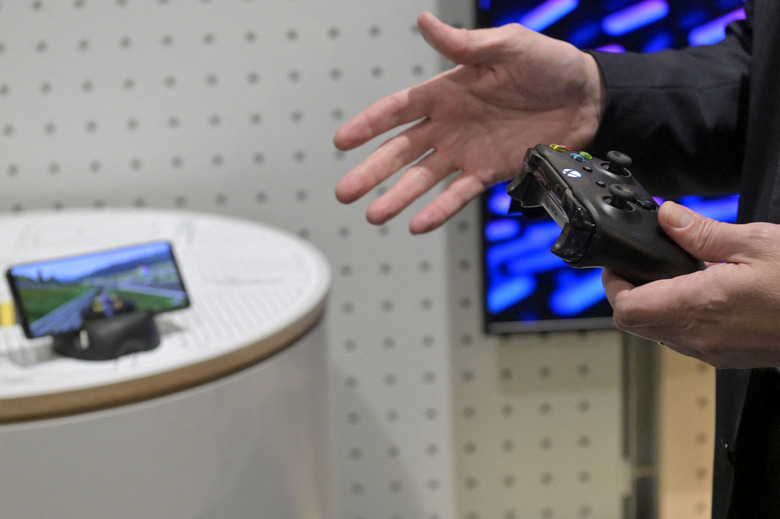 Illustration picture show a Microsoft Xbox controller with a 5G phone during a visit to Ericsson company in Kista, Stockholm during a visit to Sweden on Friday 18 March 2022, part of a mission of the Flemish Minister President to Norway and Sweden. BELGA PHOTO DIRK WAEM (Photo by DIRK WAEM / BELGA MAG / Belga via AFP) (Photo by DIRK WAEM/BELGA MAG/AFP via Getty Images)