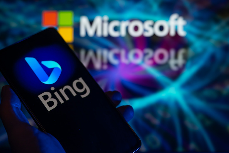 A smart phone is displaying Bing with Microsoft visible in the background in this photo illustration in Brussels, Belgium, on December 30, 2023. (Photo by Jonathan Raa/NurPhoto via Getty Images)