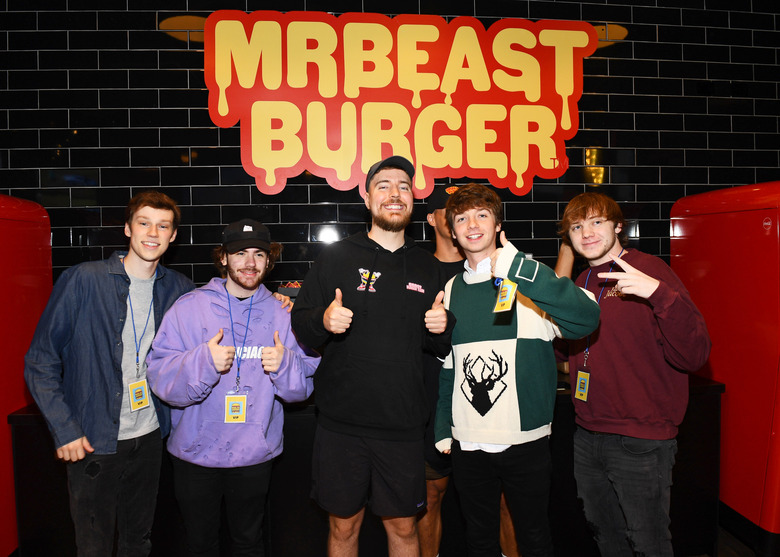 EAST RUTHERFORD, NEW JERSEY - SEPTEMBER 04: (L-R) Nolan Hansen, Sapnap, MrBeast, Karl Jacobs and Punz attend as Global YouTube star MrBeast launches the first physical MrBeast Burger Restaurant at American Dream on September 4, 2022 in East Rutherford, New Jersey. (Photo by Dave Kotinsky/Getty Images for MrBeast Burger)