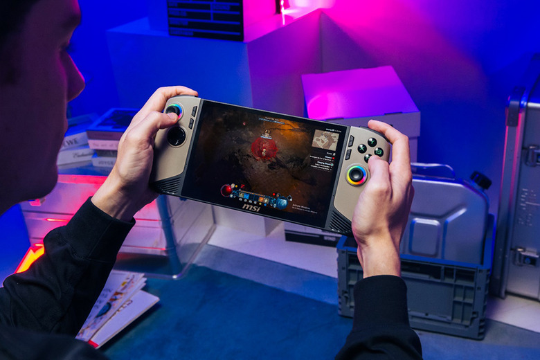 Product lifestyle shot of a gamer in a blue and purple room playing the MSI Claw handheld.