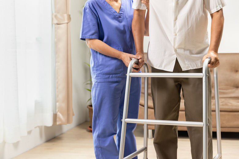 Caregiver takecare older man that having Sarcopenia or muscle loss. Sarcopenia is a degenerative disease of the muscle usually caused by the natural consequence of aging.