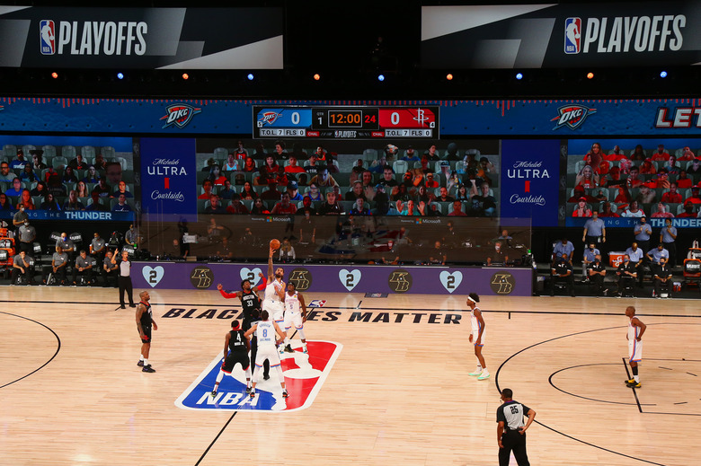 LAKE BUENA VISTA, FLORIDA - AUGUST 24: Robert Covington #33 of the Houston Rockets and Steven Adams #12 of the Oklahoma City Thunder jump for the opening tip off of game four of the first round of the 2020 NBA Playoffs at AdventHealth Arena at ESPN Wide World Of Sports Complex on August 24, 2020 in Lake Buena Vista, Florida. NOTE TO USER: User expressly acknowledges and agrees that, by downloading and or using this photograph, User is consenting to the terms and conditions of the Getty Images License Agreement. (Photo by Kim Klement-Pool/Getty Images)