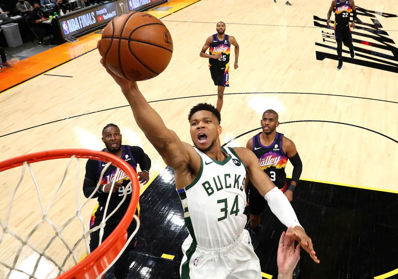 Jul 8, 2021; Phoenix, Arizona, USA; Milwaukee Bucks forward Giannis Antetokounmpo (34) moves in for a basket ahead of Phoenix Suns forward Jae Crowder (99) and guard Chris Paul (3) during game two of the 2021 NBA Finals at Phoenix Suns Arena. Mandatory Credit: Mark J. Rebilas-USA TODAY Sports     TPX IMAGES OF THE DAY