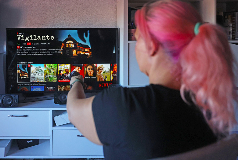 MADRID, SPAIN - OCTOBER 14: A user connects to the Netflix platform on October 14, 2022, in Madrid, Spain. The U.S. entertainment company and streaming platform has decided to activate its first plan with advertising in November, which will be available in 12 countries. Depending on the country, between 5% and 10% of the titles will not be available in the basic version. The new cheaper plan with ads will cost 5.49 euros per month, two and a half euros less than at present. 