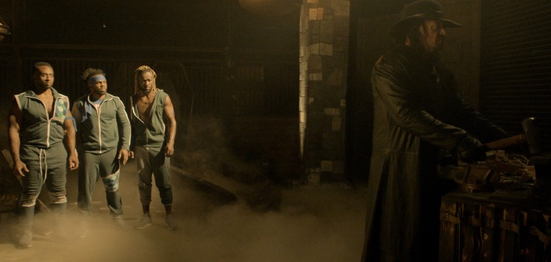 Escape The Undertaker. (L-R) Big E, Xavier Woods, Kofi Kingston and The Undertaker in Escape The Undertaker. c. Netflix Â© 2021