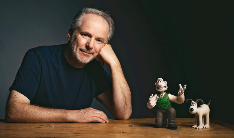 Nick Park, creator and director of ‘Wallace & Gromit’ poses next to figurines of the main two characters.