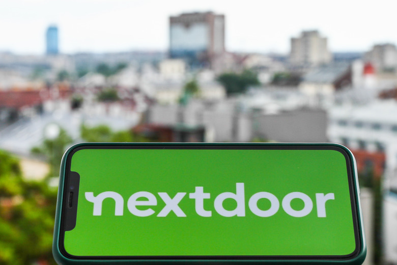 Nextdoor logo is seen displayed on a phone screen in this illustration photo taken in Krakow, Poland on July 3, 2021. (Photo illustration by Jakub Porzycki/NurPhoto via Getty Images)