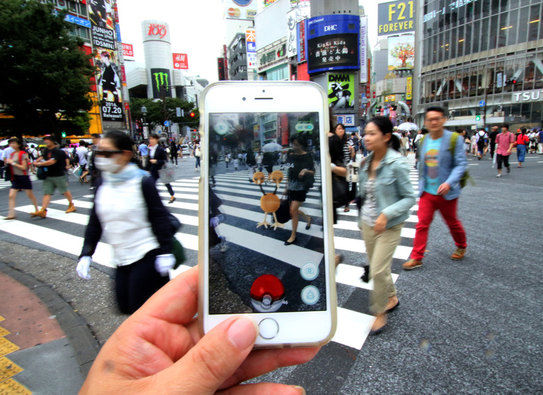 Nintendo's Pokemon Go game is played on a mobile phone at Tokyo's famous Shibuya crossing on July 22, 2016. The augmented-reality (AR) game PokemonGO was released in Japan. (Photo by YOSHIKAZU TSUNO/Gamma-Rapho via Getty Images)