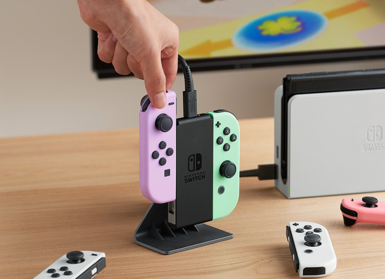 A charging station and controllers on a table.