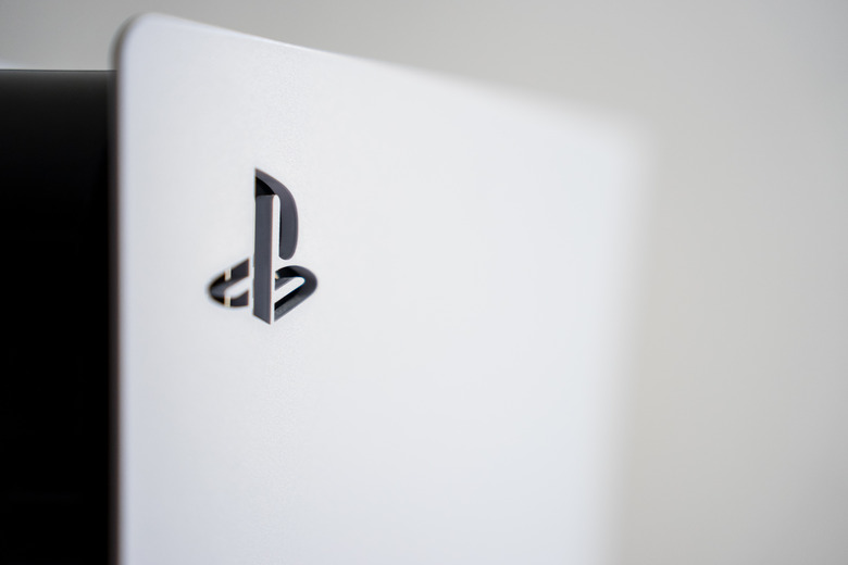 The PlayStation 5 logo on the surface of a PS5 console. (Photo by Nikos Pekiaridis/NurPhoto via Getty Images)