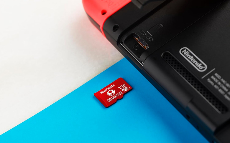 A microSD card sliding into the Switch.