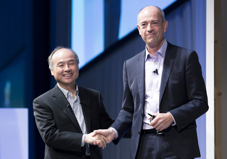 TOKYO, JAPAN - JULY 20:  SoftBank Group Corp. Chief Executive Officer Masayoshi Son, left, shakes hands with ARM Holdings Plc Chief Executive Officer Simon Segars during the SoftBank World 2017 conference on July 20, 2017 in Tokyo, Japan. With 70 speeches and sessions, the annual business event hosted by SoftBank, Japan's multinational telecommunications and internet company, takes place for 2 days until July 21. (Photo by Tomohiro Ohsumi/Getty Images)