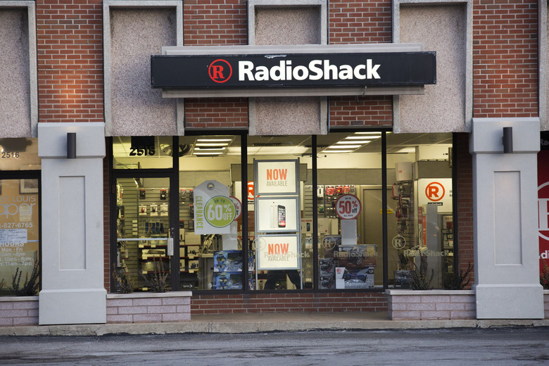 St. Louis, Missouri, USA - January 6, 2015: With a weathered, worn sign above the door, a RadioShack (NYSE: RSH) retail store located on Brentwood Boulevard in St. Louis, Missouri announces clearance sales with store signs in windows.
