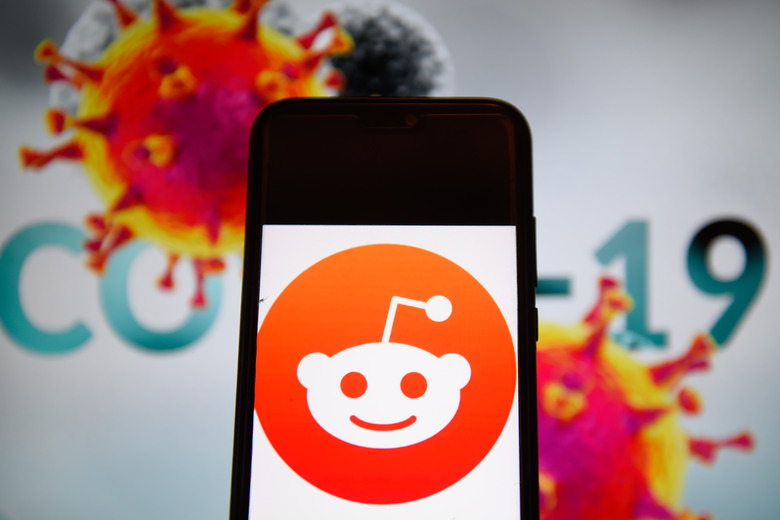 POLAND - 2020/04/10: In this photo illustration a Reddit logo is seen displayed on a smartphone with a  COVID 19 sample on the background. (Photo Illustration by Omar Marques/SOPA Images/LightRocket via Getty Images)