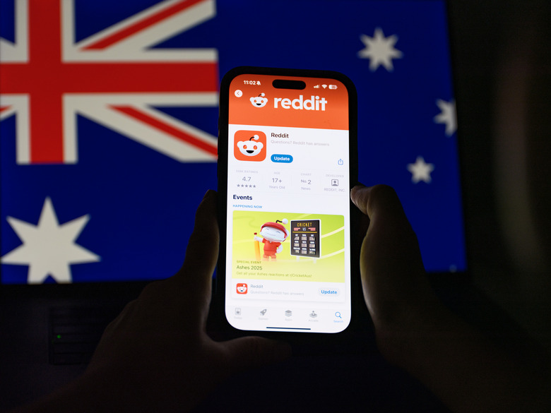 SYDNEY, AUSTRALIA - DECEMBER 07: In this photo illustration, the Reddit app is displayed on a phone with the Australian flag displayed in the background on December 7, 2025 in Sydney, Australia. The Online Safety Amendment (Social Media Minimum Age) Act 2024 requires social media platforms, including TikTok, Instagram, Facebook, YouTube, Snapchat, X, Reddit, Threads, Twitch, and Kick to implement age-verification systems and take reasonable steps to prevent account creation by users under 16, with non-compliant platforms facing penalties of up to A$50 million. (Photo Illustration by George Chan/Getty Images)