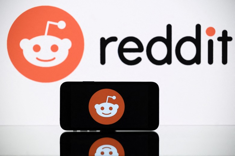 A picture taken on October 5, 2021 in Toulouse shows the logo of Reddit social media displayed by a by a tablet and a smartphone. (Photo by Lionel BONAVENTURE / AFP) (Photo by LIONEL BONAVENTURE/AFP via Getty Images)