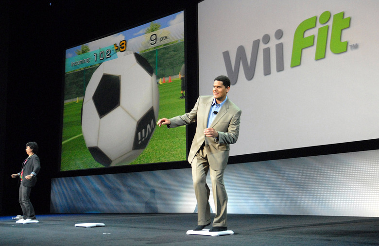 SANTA MONICA, CA - JULY 11:  Nintendo of America President Reggie Fils-Aime (right) competes against legendary Nintendo video game designer Shigeru Miyamoto in Wii Fit, an upcoming motion-controlled video game that features agility, balance and fitness challenges during Nintendo's media briefing July 11, 2007 in Santa Monica, California. (Photo by Bob Riha, Jr./WireImage)