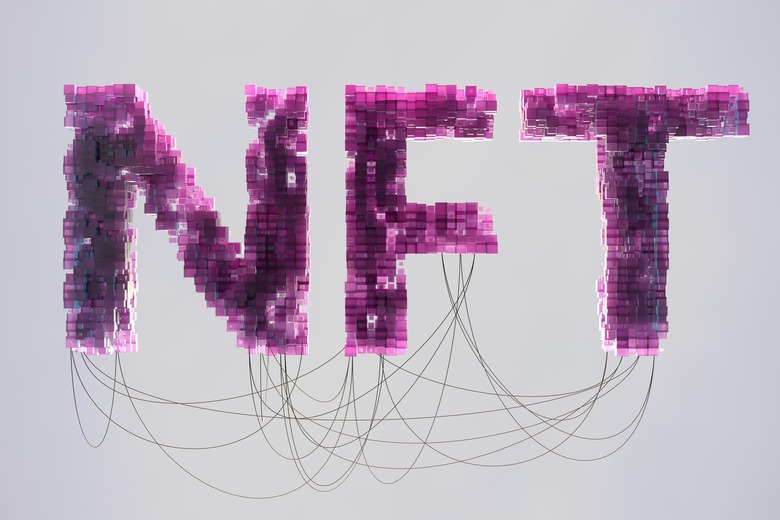 Digital generated image of semi transparent cubes connecting together and forming big letters NFT visualising blockchain technology and non-fungible token art.