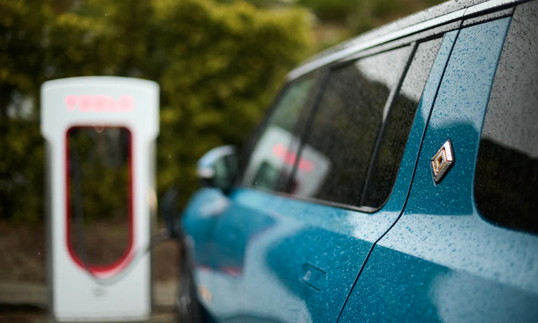 A Rivian EV parked at a charging station. 