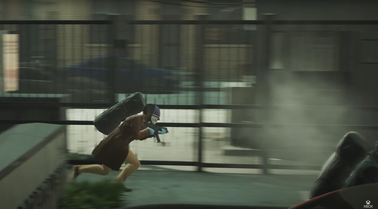 a guy in a mask wearing a dufflebag full of cash running from the cops