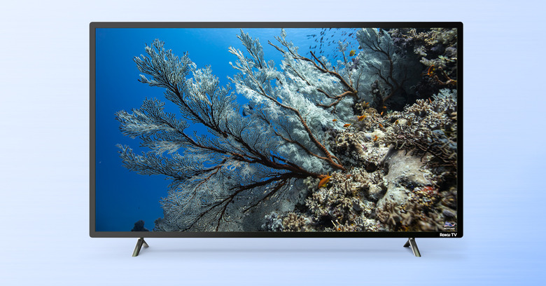 A 6-Series 8K TCL Roku TV showing an image of underwater flora.