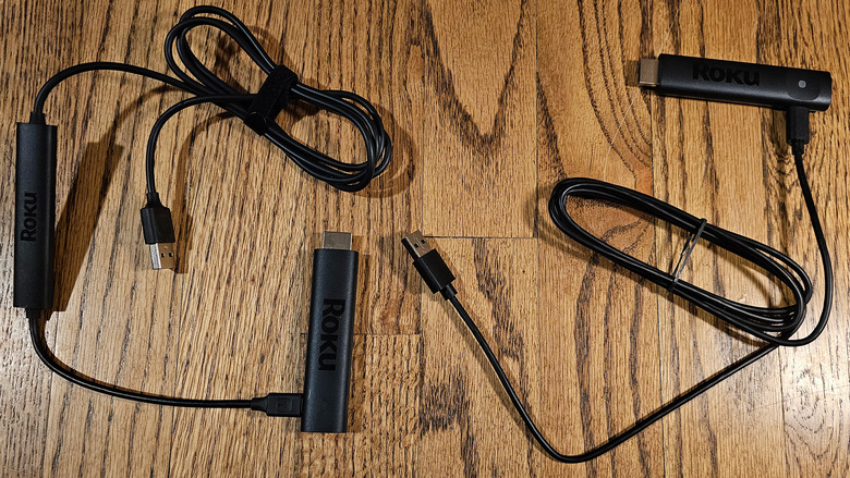 The Roku Streaming Stick 4K (left) with it's cable, Wi-Fi extender and dongle. The Roku Streaming Stick Plus (right) with it's cable and dongle.