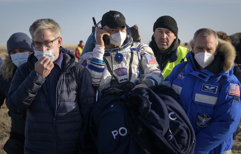 ZHEZKAZGAN, KAZAKHSTAN - MARCH 30:  In this handout image provided by the U.S. National Aeronatics and Space Administration (NASA), Expedition 66 NASA astronaut Mark Vande Hei is carried to a medical tent shortly after he and fellow crew mates Pyotr Dubrov and Anton Shkaplerov of Roscosmos landed in their Soyuz MS-19 spacecraft near the town of Zhezkazgan on March 30, 2022 in Zhezkazgan, Kazakhstan. Vande Hei and Dubrov are returning to Earth after logging 355 days in space as members of Expeditions 64-66 aboard the International Space Station. For Vande Hei, his mission is the longest single spaceflight by a U.S. astronaut in history. Shkaplerov is returning after 176 days in space, serving as a Flight Engineer for Expedition 65 and commander of Expedition 66. (Photo by Bill Ingalls/NASA/Getty Images)