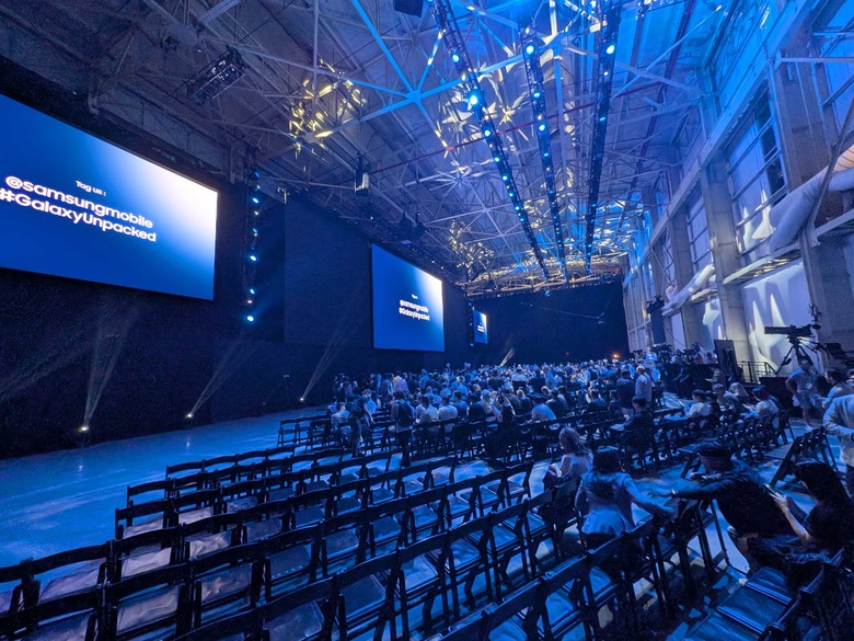 The seating area in front of the stage at Samsung Galaxy Unpacked July 2025 in Brooklyn, with row of empty chairs near the side.
