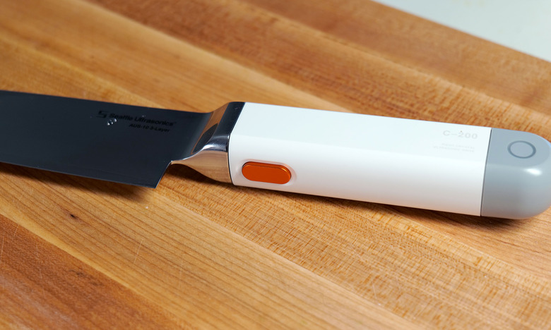 You won't be able to feel it, but pressing this button allows the C-200's blade to vibrate 30,000 times per second.