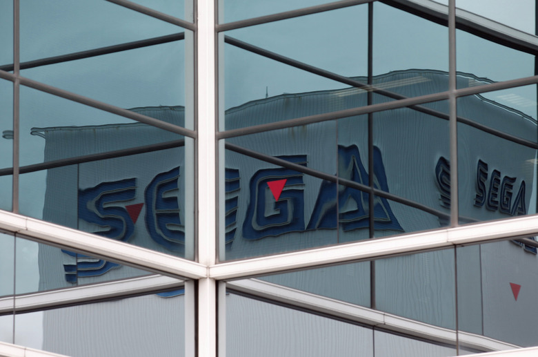 Sega Corp. logos are reflected in windows near the company headquarters in Tokyo June 20, 2011. Japanese video game developer Sega Corp said on Sunday that information belonging to 1.3 million customers has been stolen from its database, the latest in a rash of global cyber attacks against video game companies. REUTERS/Kim Kyung-Hoon (JAPAN - Tags: CRIME LAW SCI TECH BUSINESS)