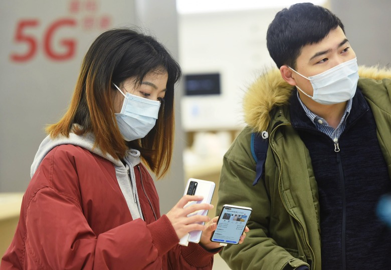 HANGZHOU, CHINA - MARCH 30, 2020 - Customers experience P40 series mobile phones in Huawei flagship store, Hangzhou, Zhejiang, China, March 30, 2020. Huawei's first 5g flagship cell phone P40 series appeared in Hangzhou this year, attracting many Hangzhou citizens to experience its unique extreme photography ability. - PHOTOGRAPH BY Costfoto / Barcroft Studios / Future Publishing (Photo credit should read Costfoto/Barcroft Media via Getty Images)