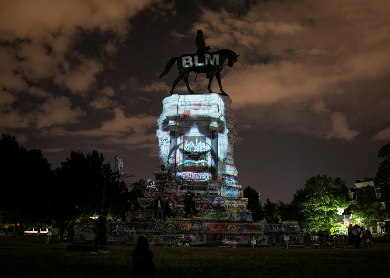 SENSITIVE MATERIAL. THIS IMAGE MAY OFFEND OR DISTURB Artist Dustin Klein projects an image of George Floyd onto the statue of Confederate General Robert E. Lee in Richmond, Virginia, U.S. June 18, 2020. REUTERS/Julia Rendleman TPX IMAGES OF THE DAY