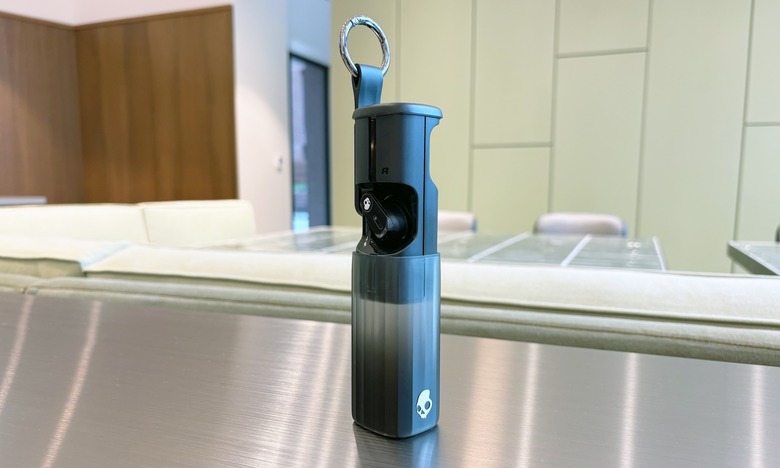The charging case is on the larger side, to put it mildly, and uses a sliding mechanism to open and close.