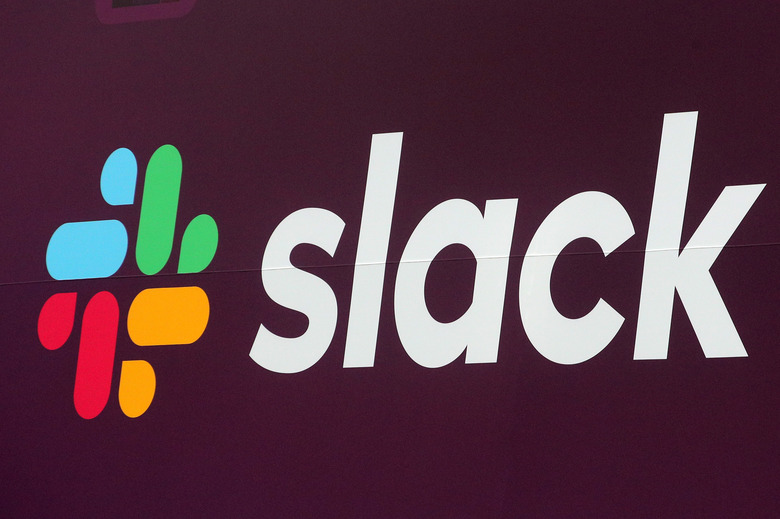 The Slack Technologies Inc. logo is seen on a banner outside the New York Stock Exchange (NYSE) during thew company's IPO in New York, U.S. June 20, 2019.  REUTERS/Brendan McDermid
