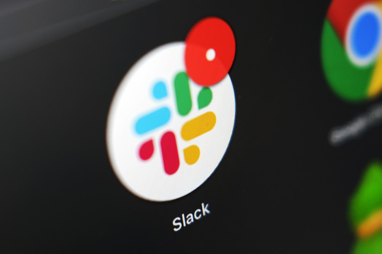 The Slack app icon is displayed on a computer screen, Wednesday, Dec 2, 2020, in Tokyo. In a deal announced Tuesday, Dec. 1, 2020, business software pioneer Salesforce.com is buying work-chatting service Slack for $27.7 billion in a deal aimed at giving the two companies a better shot at competing against longtime industry powerhouse Microsoft. (AP Photo/Kiichiro Sato)