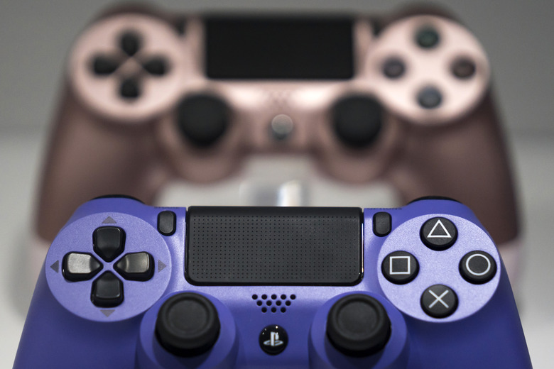 CHIBA, JAPAN - SEPTEMBER 12:  Wireless controller for the PlayStation 4 (PS4) game console are displayed in the Sony Interactive Entertainment Inc. booth on the business day of the Tokyo Game Show 2019 at Makuhari Messe on September 12, 2019 in Chiba, Japan. The Tokyo Game Show will be open to the public on September 14 and 15, 2019. (Photo by Tomohiro Ohsumi/Getty Images)