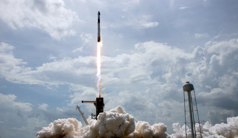 CAPE CANAVERAL, FLORIDA - MAY 30: In this NASA handout image, A SpaceX Falcon 9 rocket carrying the company's Crew Dragon spacecraft is launched from Launch Complex 39A on NASAs SpaceX Demo-2 mission to the International Space Station with NASA astronauts Robert Behnken and Douglas Hurley onboard, Saturday, May 30, 2020, at NASAs Kennedy Space Center in Florida. The Demo-2 mission is the first launch with astronauts of the SpaceX Crew Dragon spacecraft and Falcon 9 rocket to the International Space Station as part of the agencys Commercial Crew Program. The test flight serves as an end-to-end demonstration of SpaceXs crew transportation system. Behnken and Hurley launched at 3:22 p.m. EDT on Saturday, May 30, from Launch Complex 39A at the Kennedy Space Center. A new era of human spaceflight is set to begin as American astronauts once again launch on an American rocket from American soil to low-Earth orbit for the first time since the conclusion of the Space Shuttle Program in 2011.   (Photo by Bill Ingalls/NASA via Getty Images)